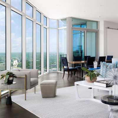 open concept living, dining room in penthouse loft with city views